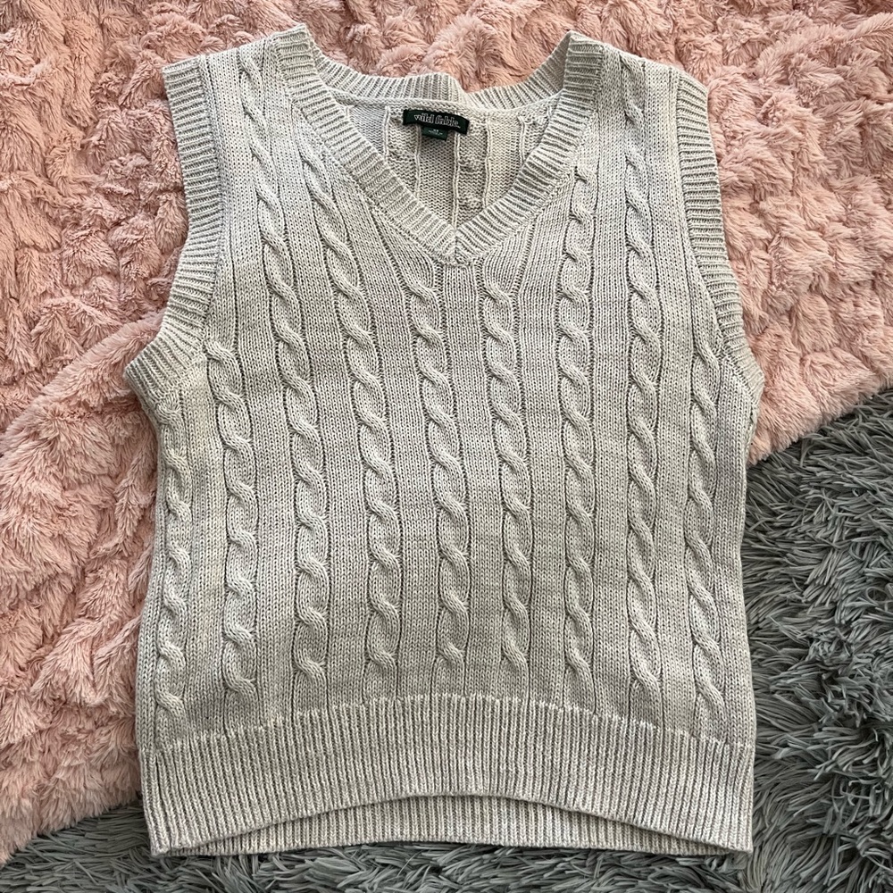 Light grey sweater vest snug fit.